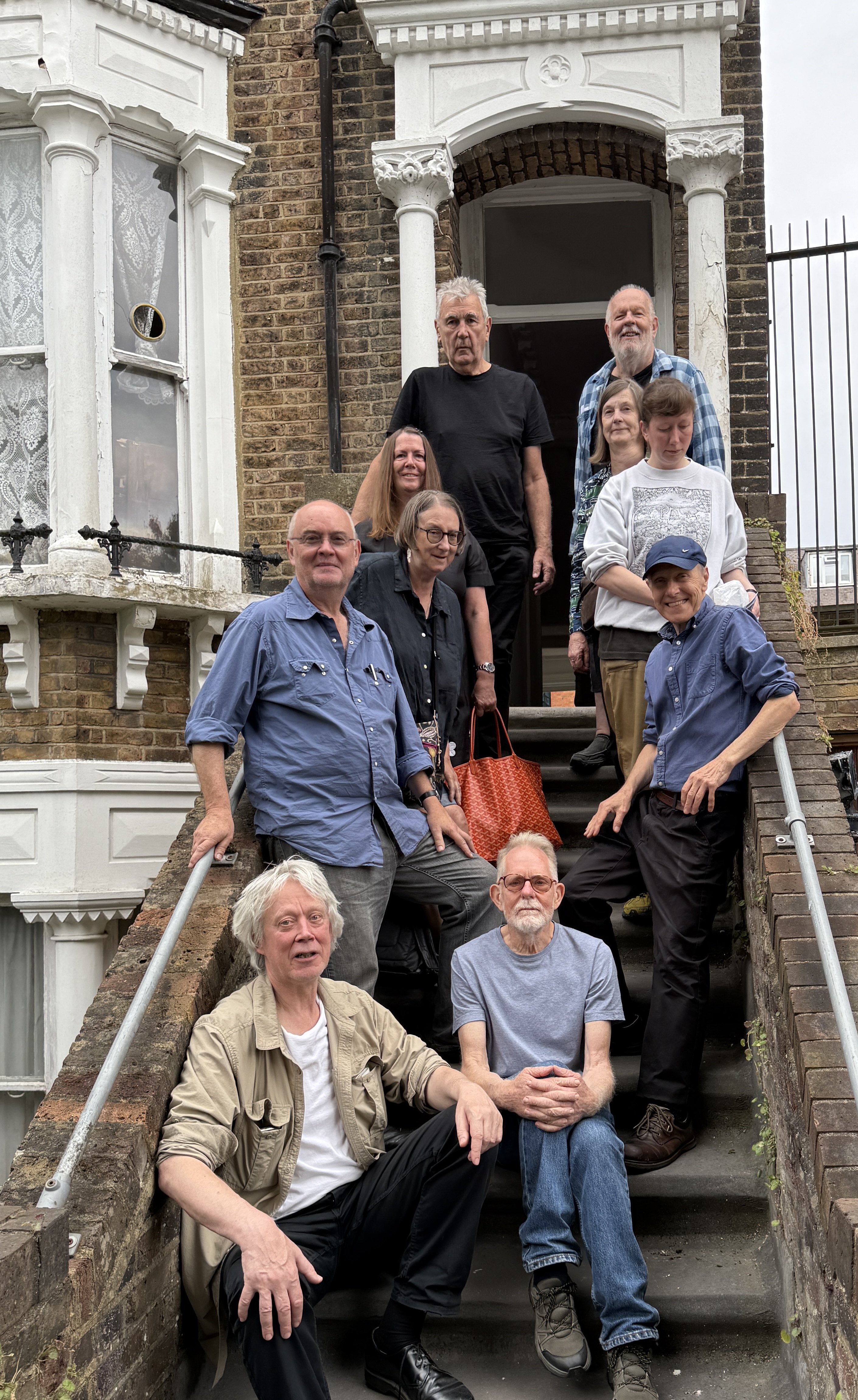 VISIT TO JOYCE EDWARD'S HOUSE GROUP ON STAIRS